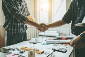 Engineers and architects handshake. Agreement and are willing to