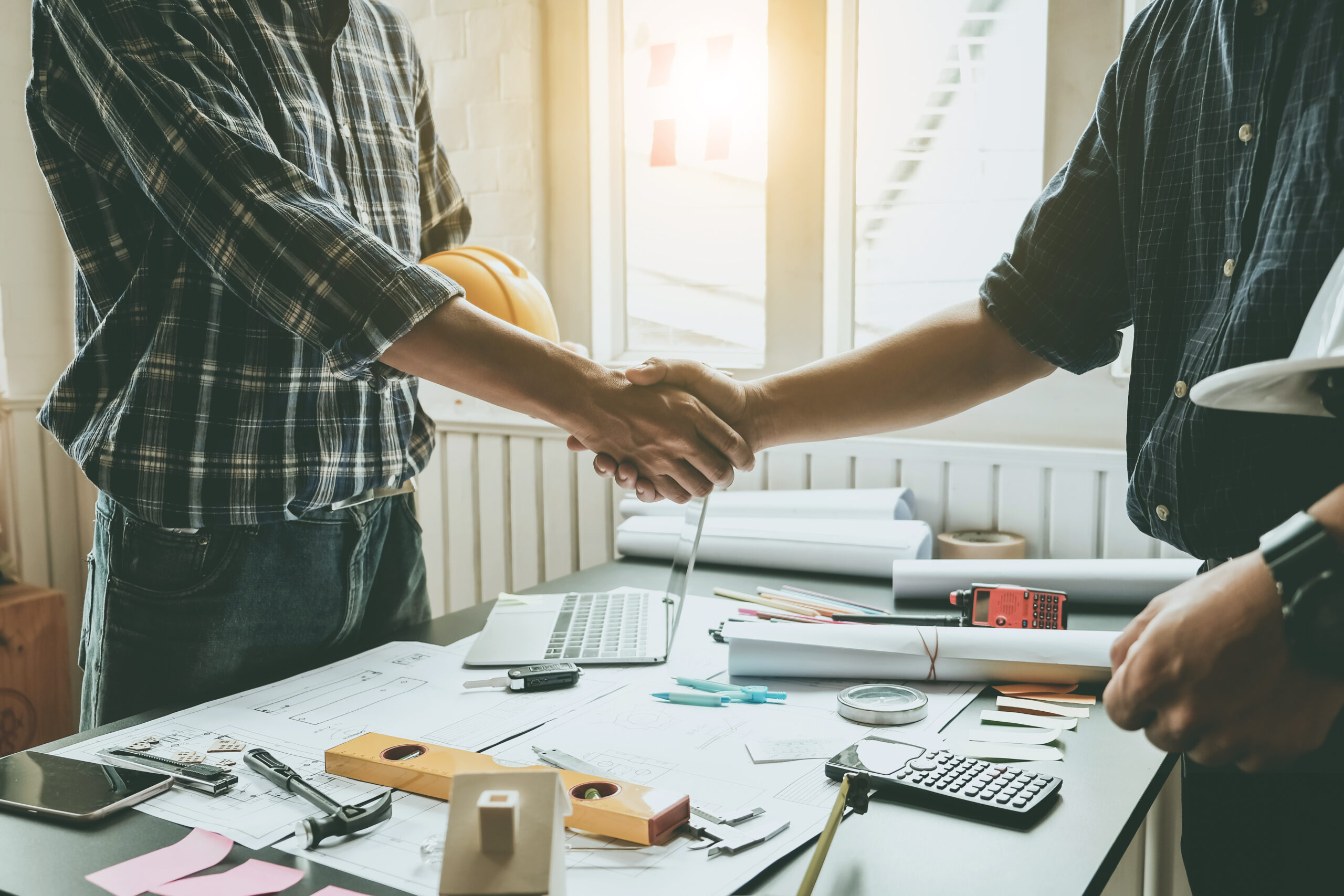 Engineers and architects handshake. Agreement and are willing to